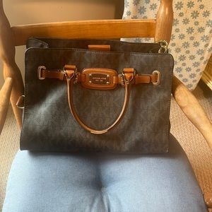 Michael Kors brown signature satchel.